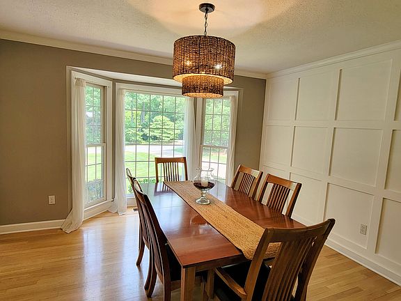 Completely renovated dining room with custom wood accent wall.
