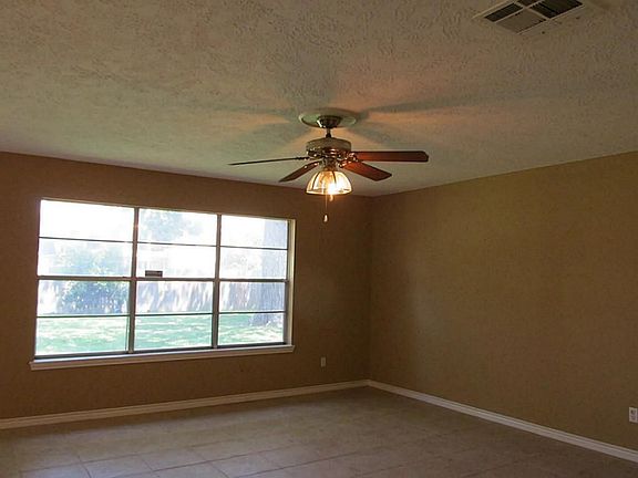 LIVING ROOM FACING BACK YARD