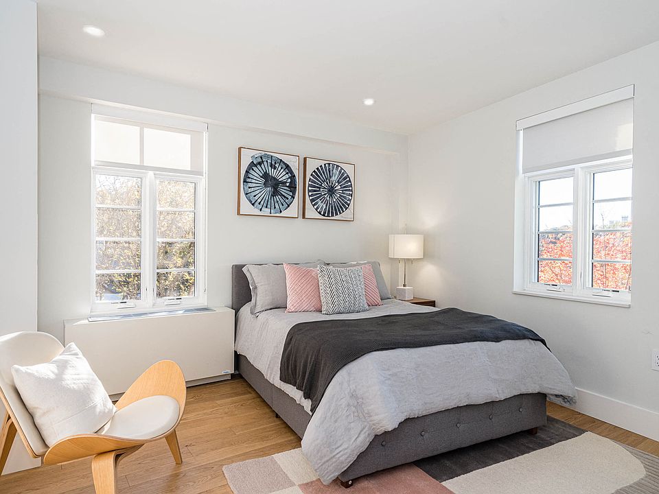 bedroom with hardwood floors and great natural light