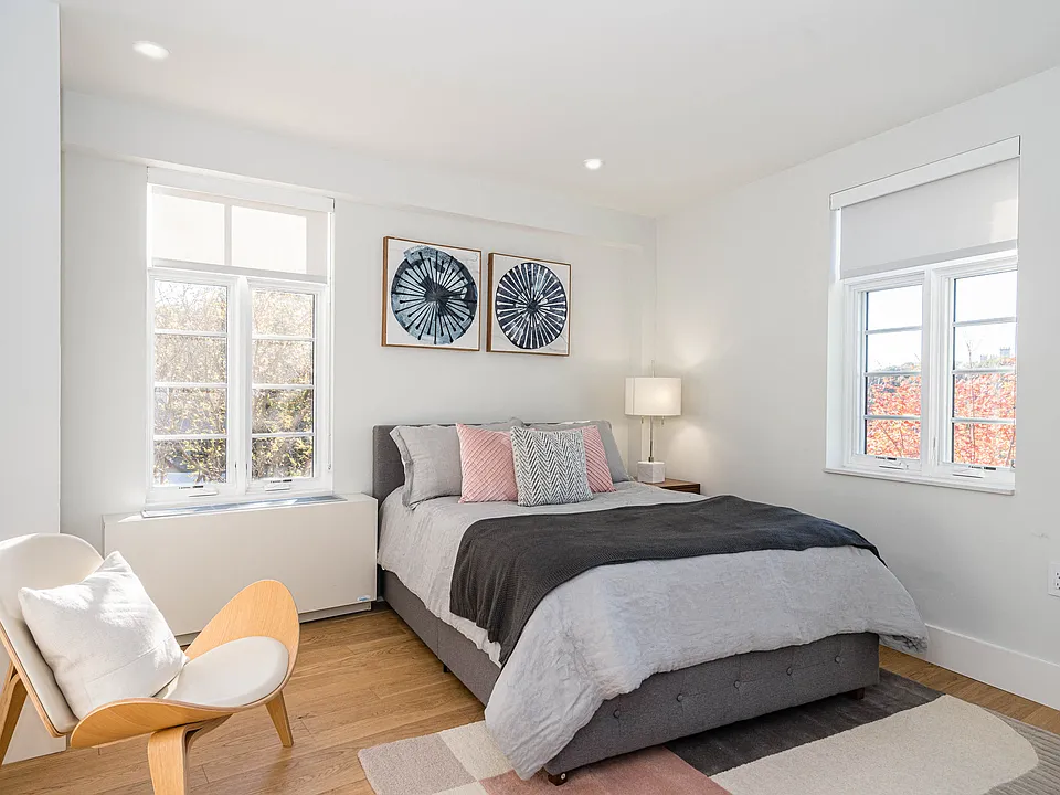 bedroom with hardwood floors and great natural light