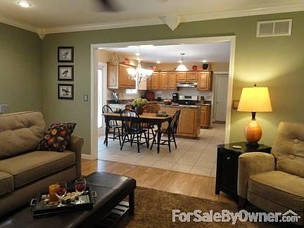 Family Room
						:
						Wall color Sage Green. Select Furniture/Accessories optional for buyer.