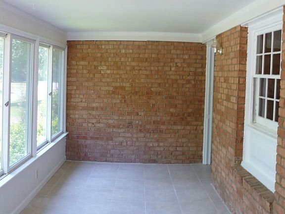 The front porch features new ceramic tile