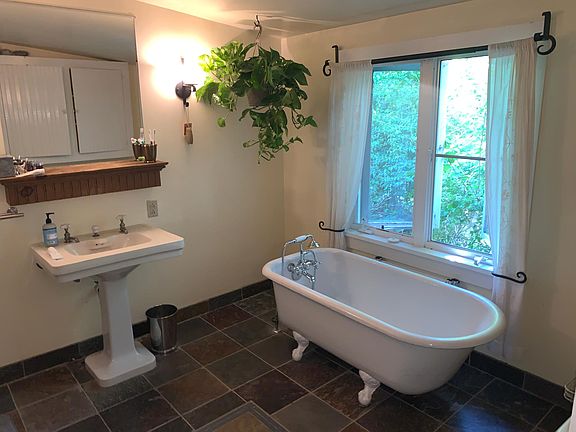 Bathroom. There's also a separate stall shower and washer/dryer.