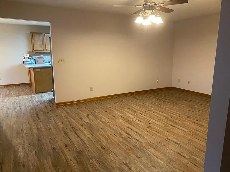 upstairs living room looking into dining room