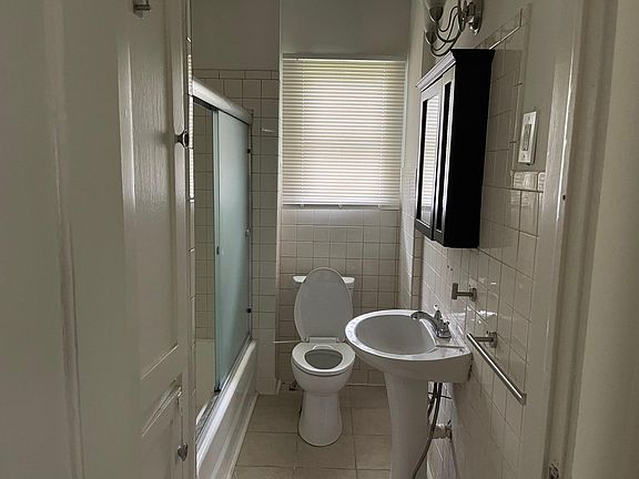 Bathroom with tiled shower.