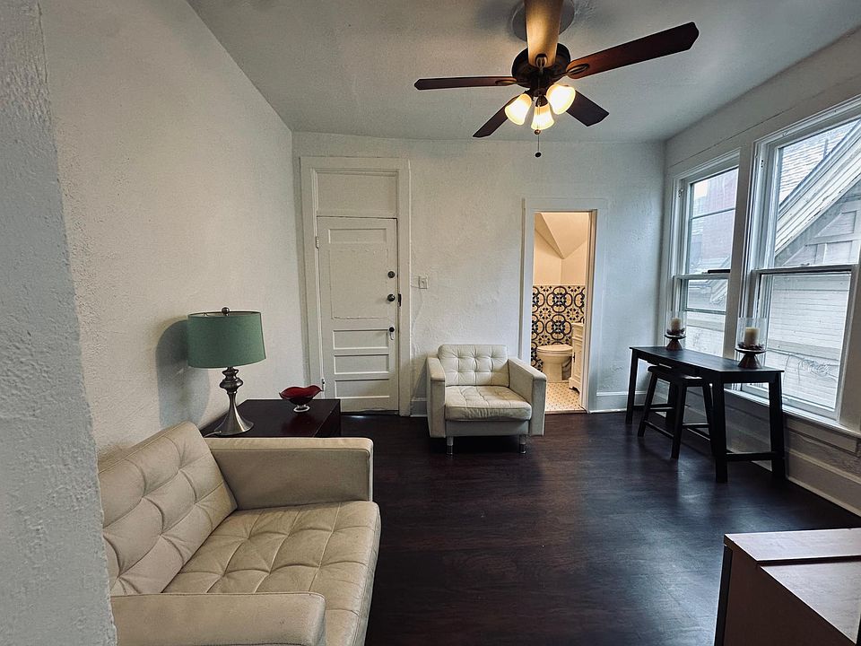 Living room, left entry door, right, the bathroom door, behind the kitchen, second back entry staircase to back yard, bedroom in the back.
North facing window