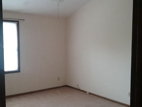 Vaulted ceiling in master bedroom with a ceiling fan 