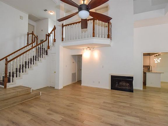 Grand staircase greets you as you enter into the wide planked front foyer.