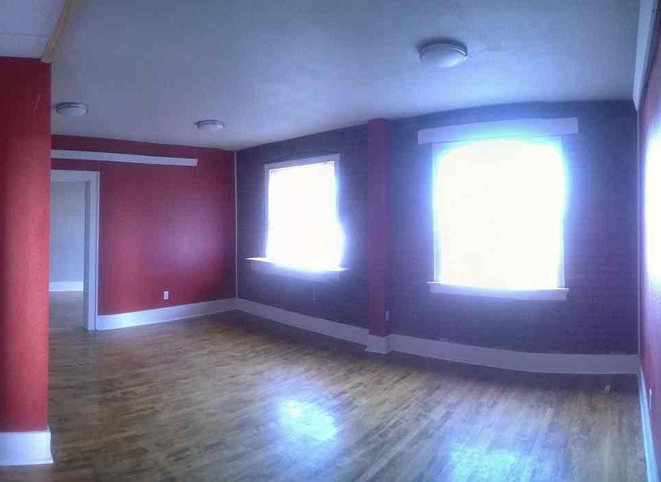Huge living room with exposed brick