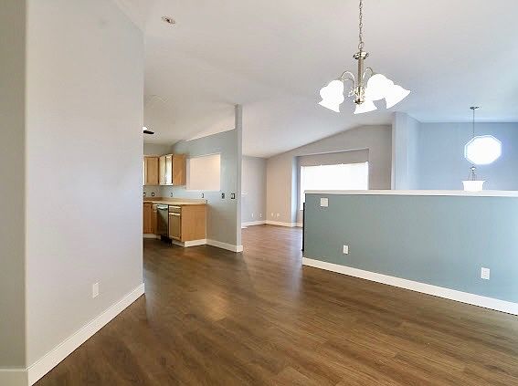 From the dining room into the kitchen and living room
