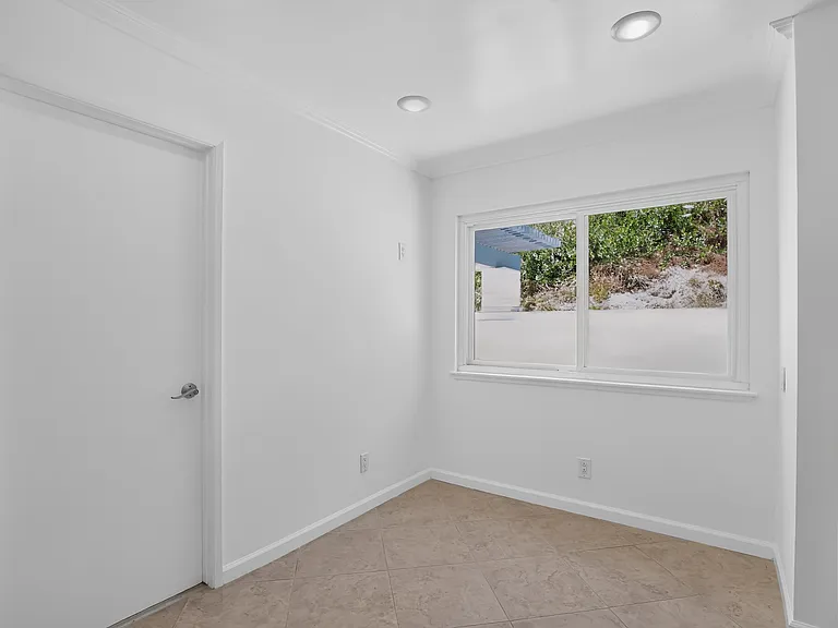 Kitchen nook leads to garage.