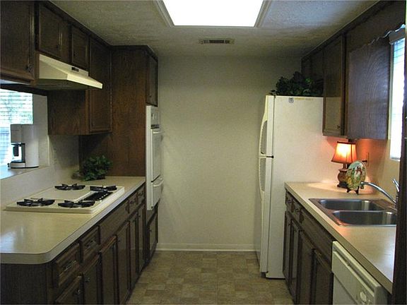 Kitchen oven, countertops, and flooring replaced. Refrigerator stays.