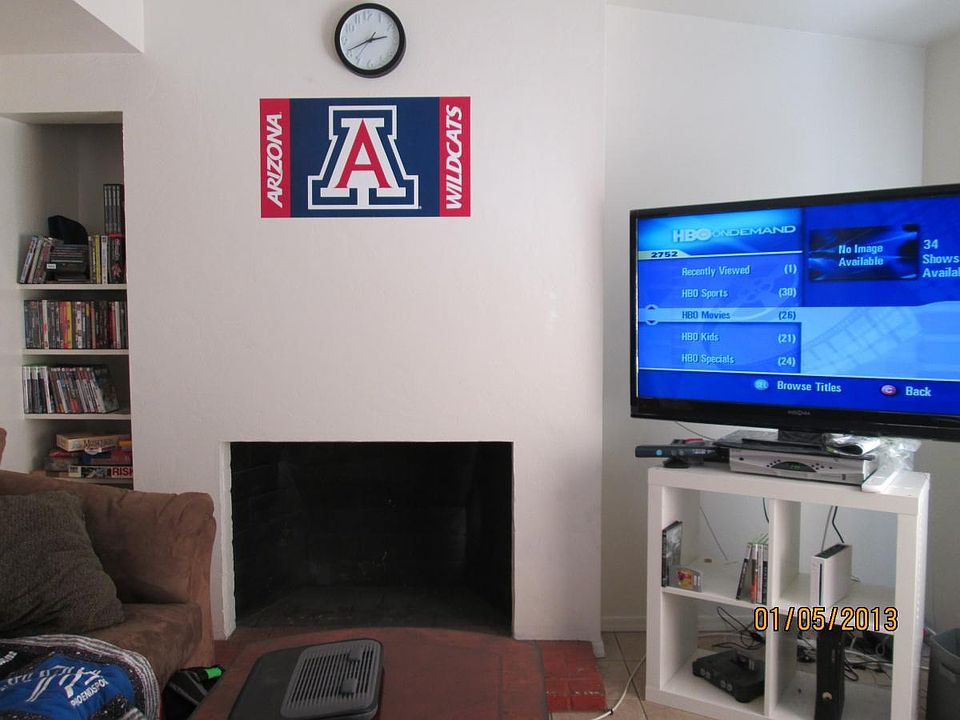 Decorative fireplace with built-in bookshelf.