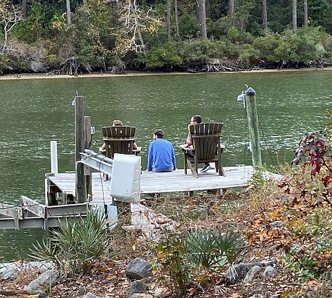 Family sitting on Dock