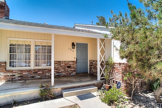 The inviting front porch with covered sitting area welcomes to the this charming three bedroom, two 