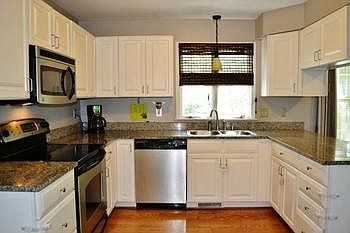 Modern kitchen with great touches. Tons of cabinets and counter space.