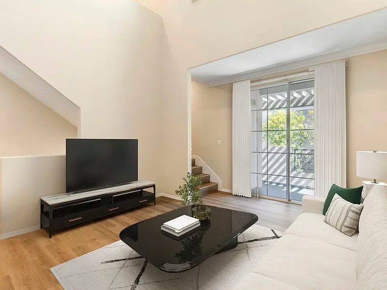 Renovated Package I living room with hard surface flooring