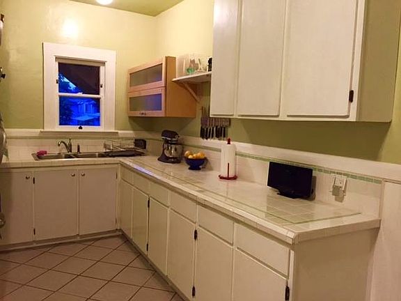 Kitchen - lots of tile counters, tile floor