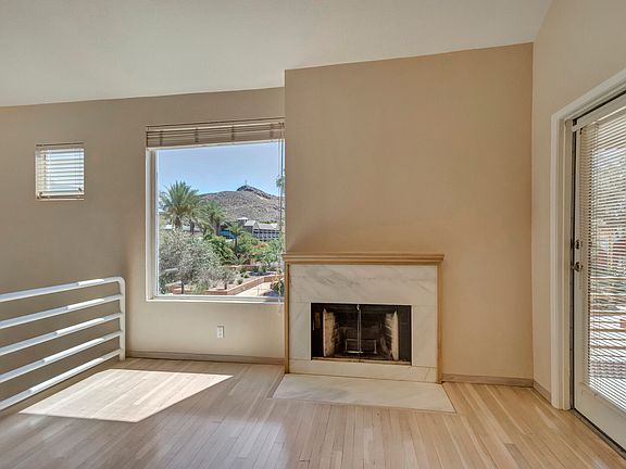 Living room with fireplace, view of "A" mountain and balcony to the right