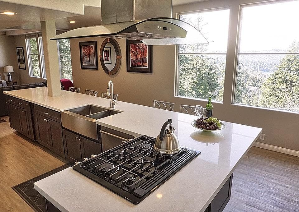 Modern functional kitchen with new appliances and lake view