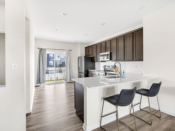 Spacious kitchen with stainless steel appliances and large pantry!