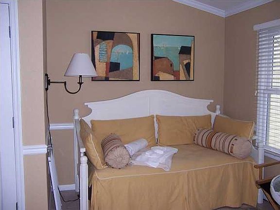 Daybed in living room located next to elevator