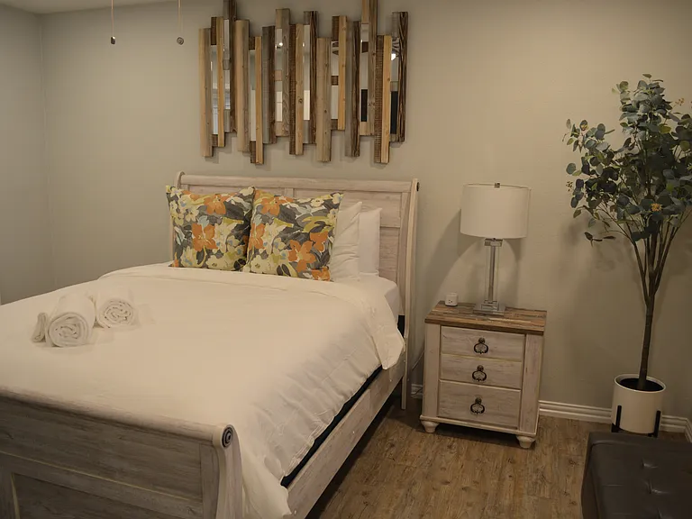 Bedroom 1 - a queen bed, smart tv and attached to bathroom 2.