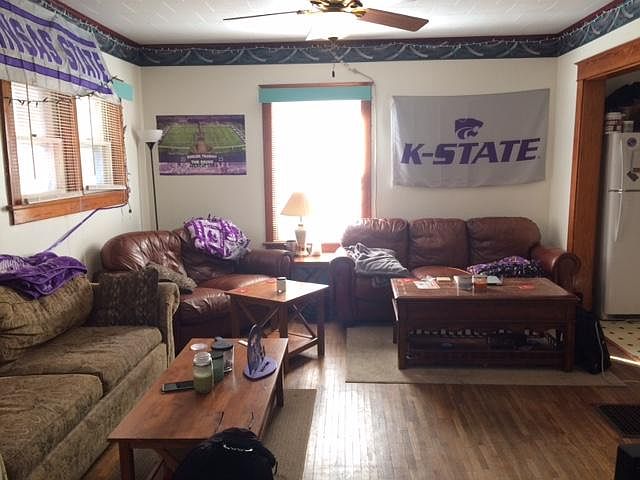 Large living room with hardwood floors-kitchen is off to the