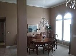 12 ft ceilings with crown molding and oval long windows