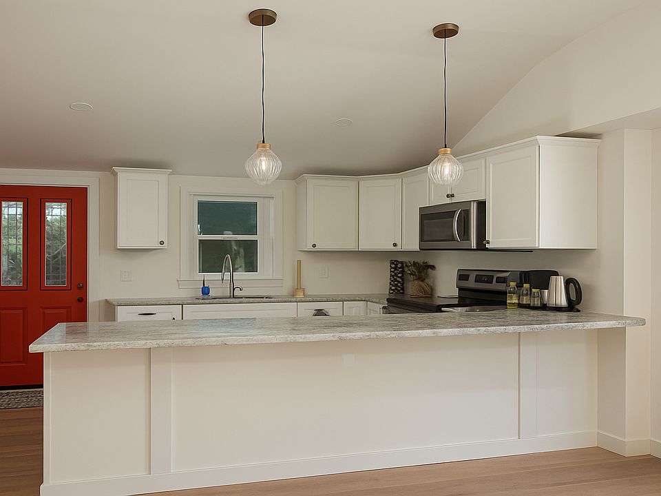 Open concept kitchen with brand new stainless appliances