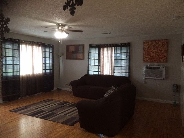 spacious living room w new windows n AC