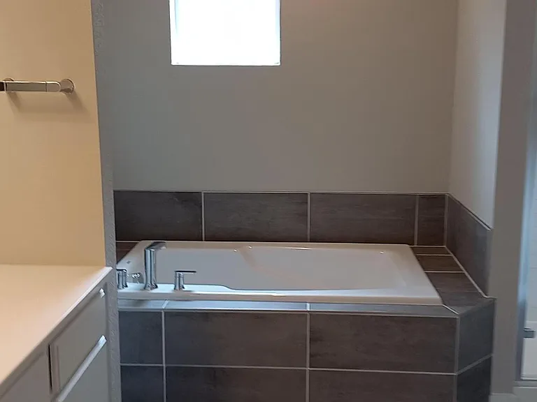 Another view of the tub left, shower right...