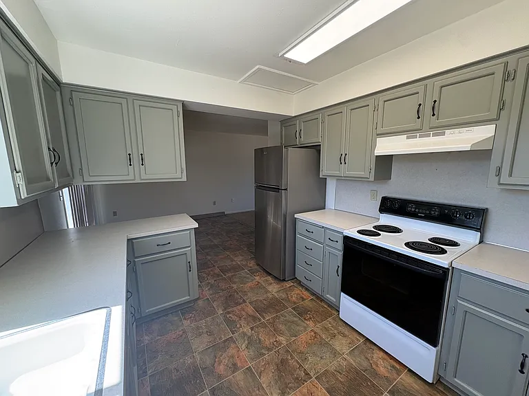 Kitchen, window over sink overlooks backyard