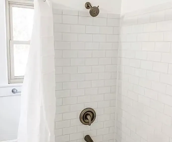 Recently renovated bathroom with subway tile.