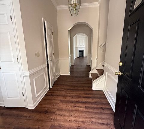 Entrance way, view of stairs to the right leading to upstairs bonus room