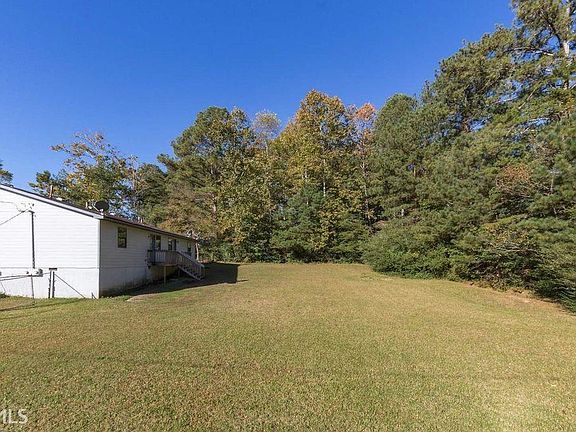 FENCED BACKYARD WITH A HUGE PLAYGROUND FOR FAMILY EVENTS