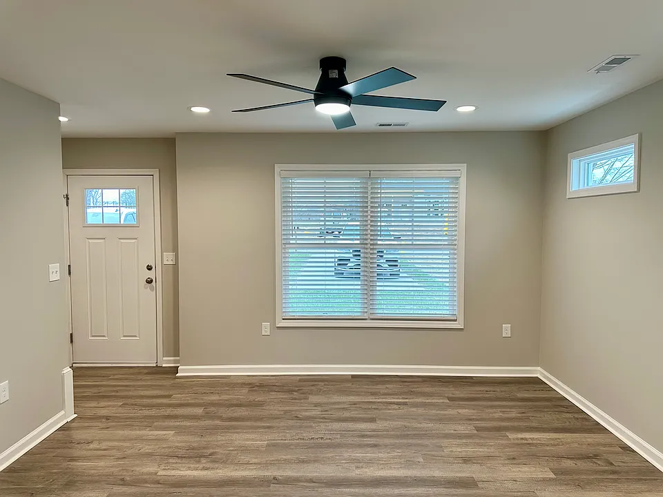 Family room w/large windows, recessed dimmable lighting, ceiling fan