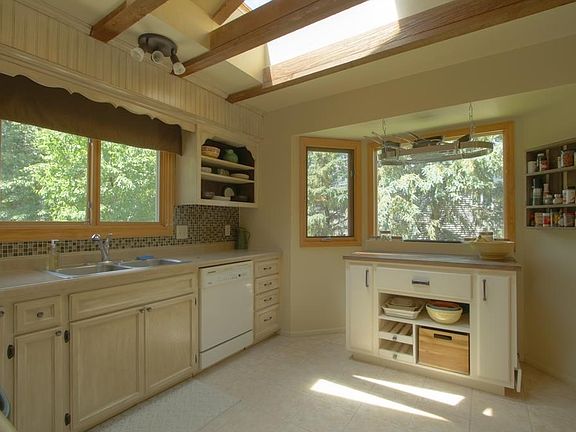 Large kitchen windows  bring in an abundance of nature and light!