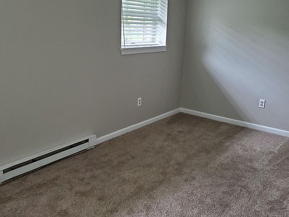 bedroom Freshly painted with newer carpet and ample closet storage space