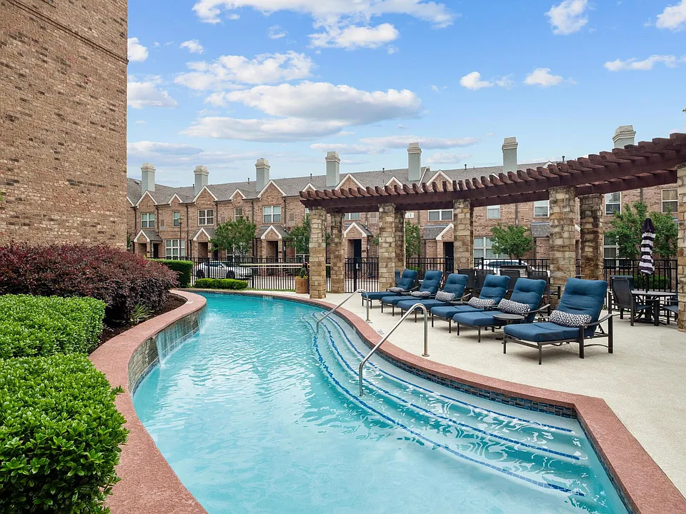 pool with lounges at Alto Highland Park