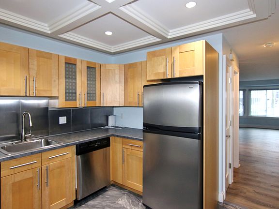 Upgraded Cabinetry and Views to Living & Dining Room