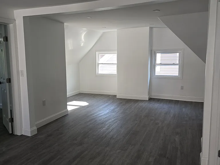 Living room area with closet.