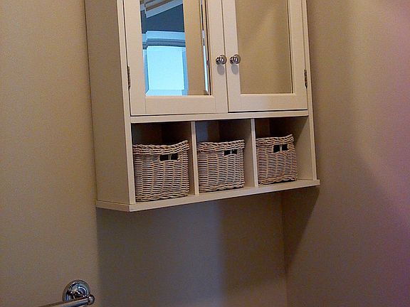Cabinet above toilet, bathroom