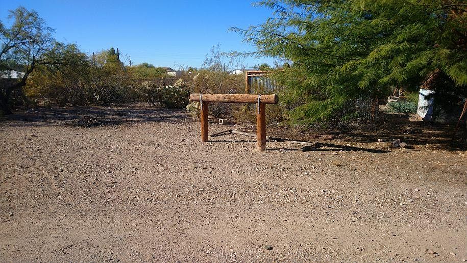 Trailer on 1 acre, partially fenced property. Zoned for horses.