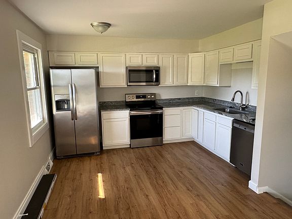 Newly remodeled kitchen with fresh appliances, new paint and refinished hardwood floors!