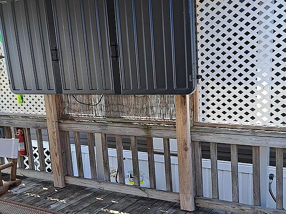 Large TV on deck, with weathercover