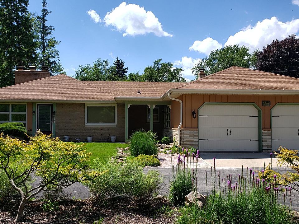 Front of Home. U-shaped driveway, Beautiful landscaping.