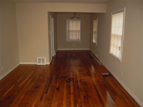 VIEW OF LIVING ROOM TO DINING AREA