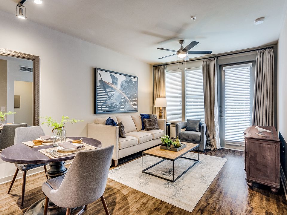 modern living room with wood plank flooring and natural lighting in Plano