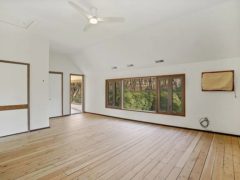 Primary Bedroom with 2 closets overlooks the rear garden.
